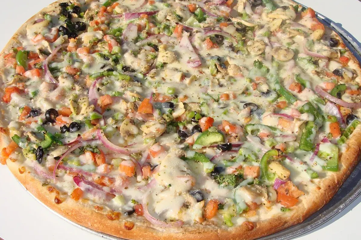 A pizza with many different toppings on it.