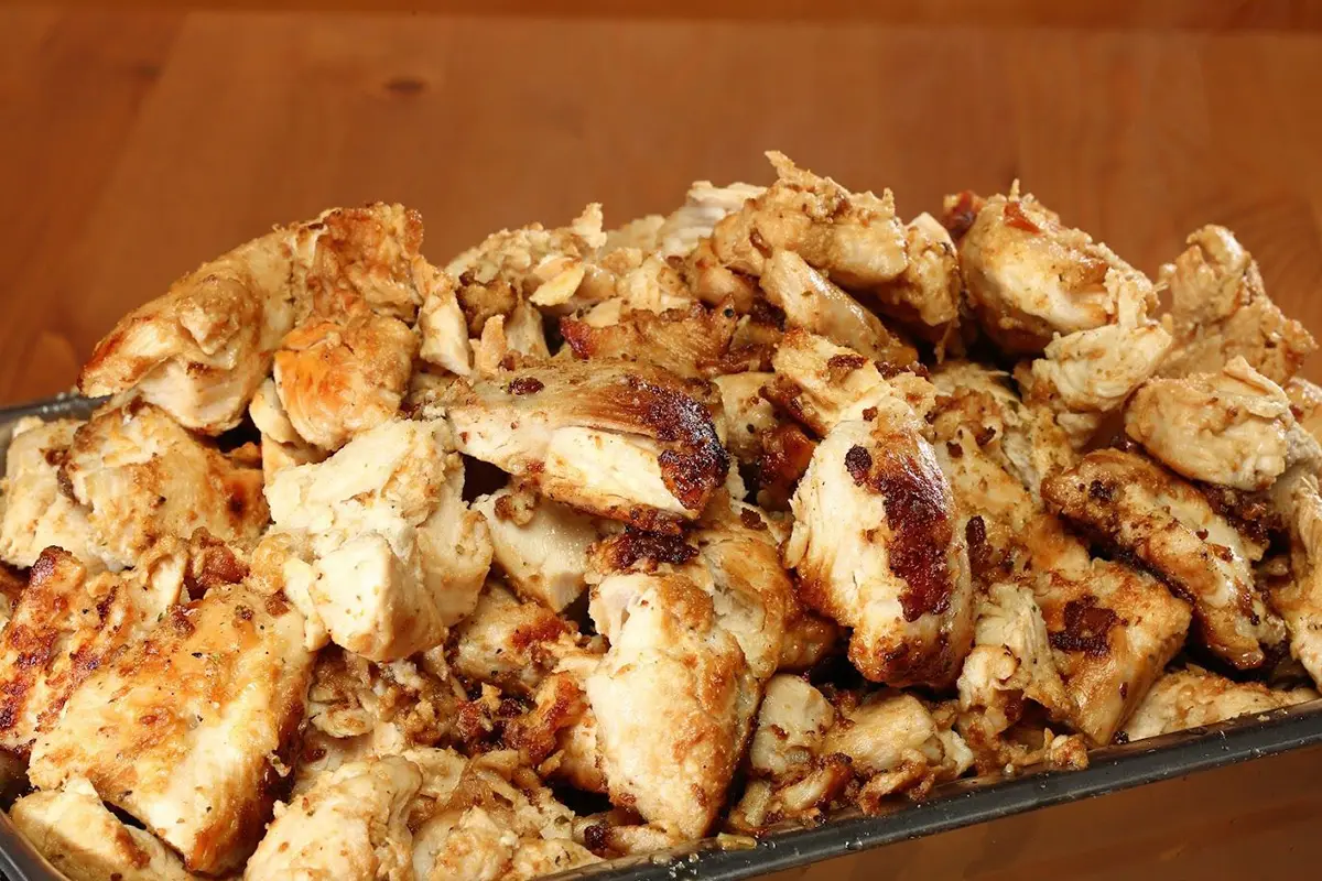 A close up of some chicken pieces on top of a table